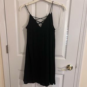 Black Dress w, Criss-cross detail and lining. Wet Seal. Size S. NWT!